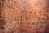 Prasat Kravan - bas reliefs on the brickwork, female figures dedicated to Lakshmi.